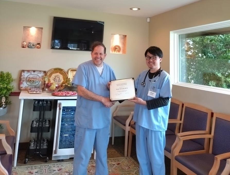 Medical professionals with achievement certificate