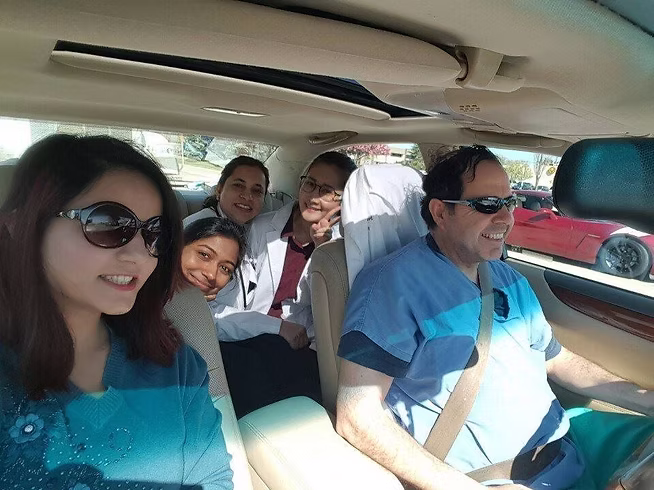 People smiling during a car ride