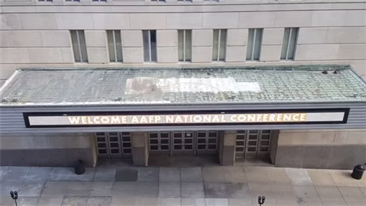 Conference welcome sign on building entrance
