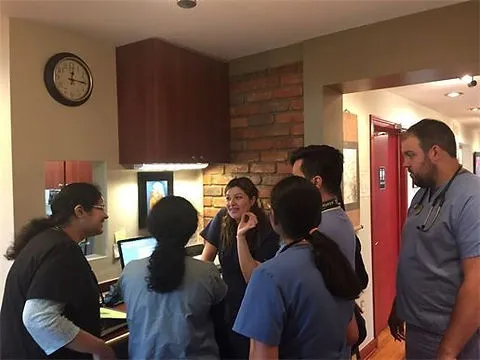 Healthcare professionals meeting near a computer