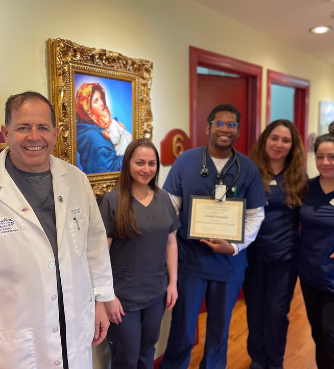 Smiling staff in clinic hallway
