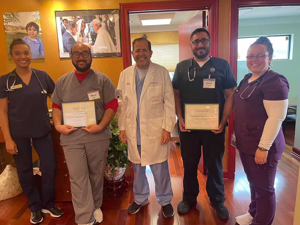 Medical team with certificates smiling