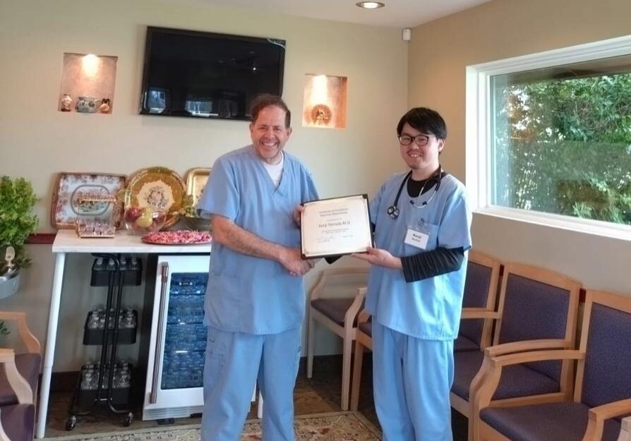 Medical professionals with achievement certificate