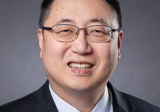 Smiling man in suit and tie